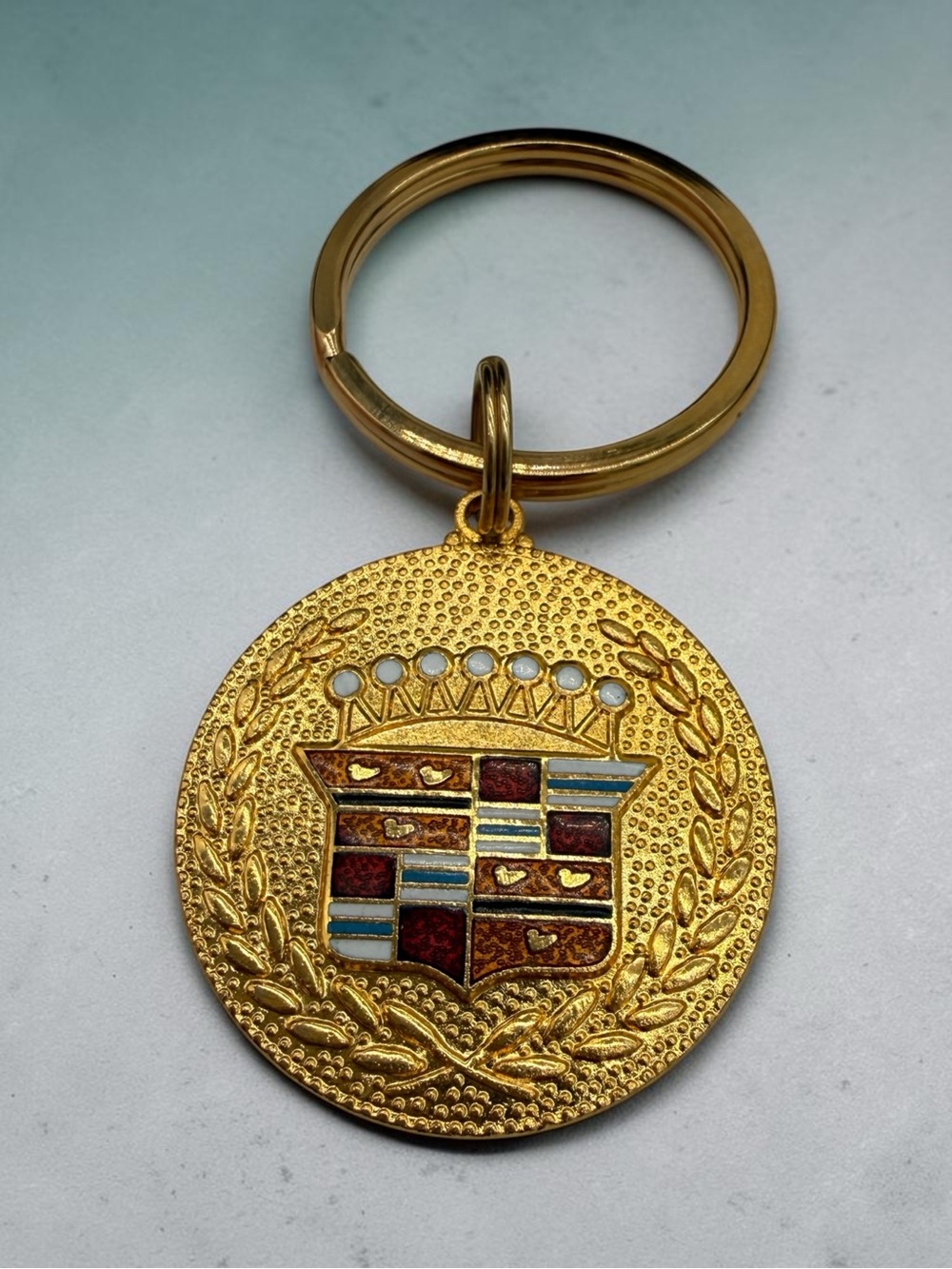 Vintage Cadillac Crest Gold-Tone Keychain with Enamel Inlay and Crown Insignia